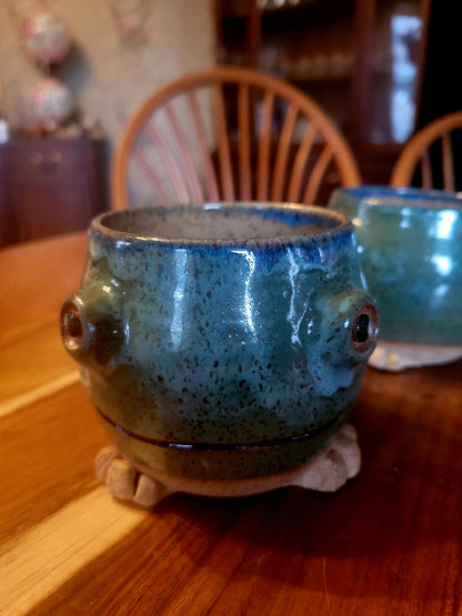Ceramic mug with a unique design on a wooden surface