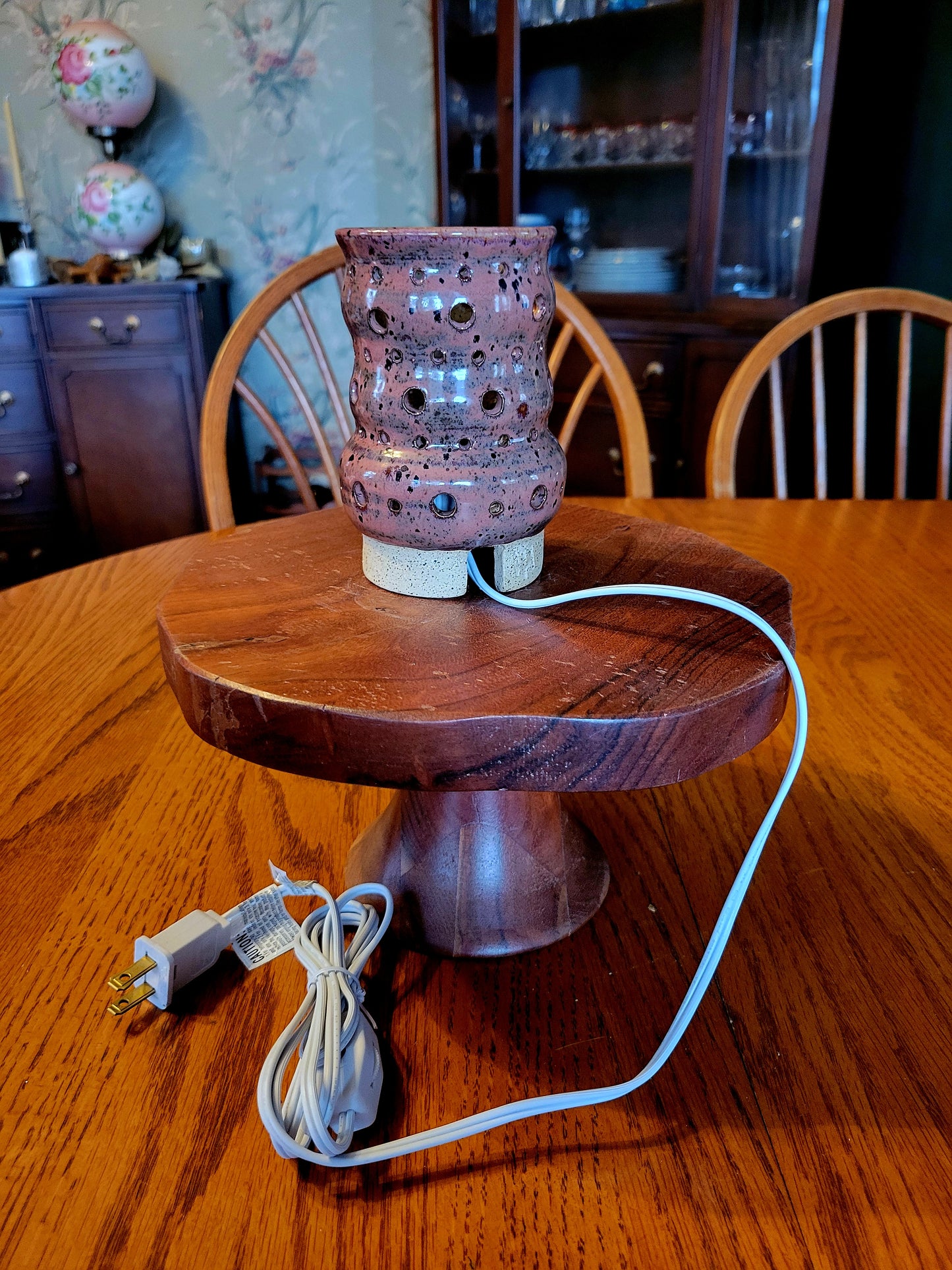 Ceramic lamp with a ceramic base on a wooden table